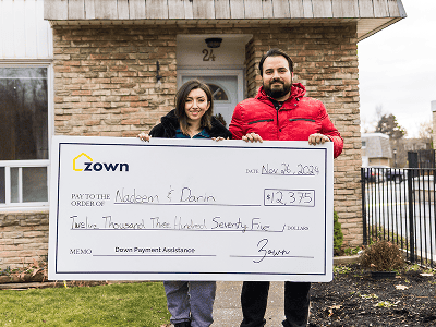 image of people recieving a cheque from zown
