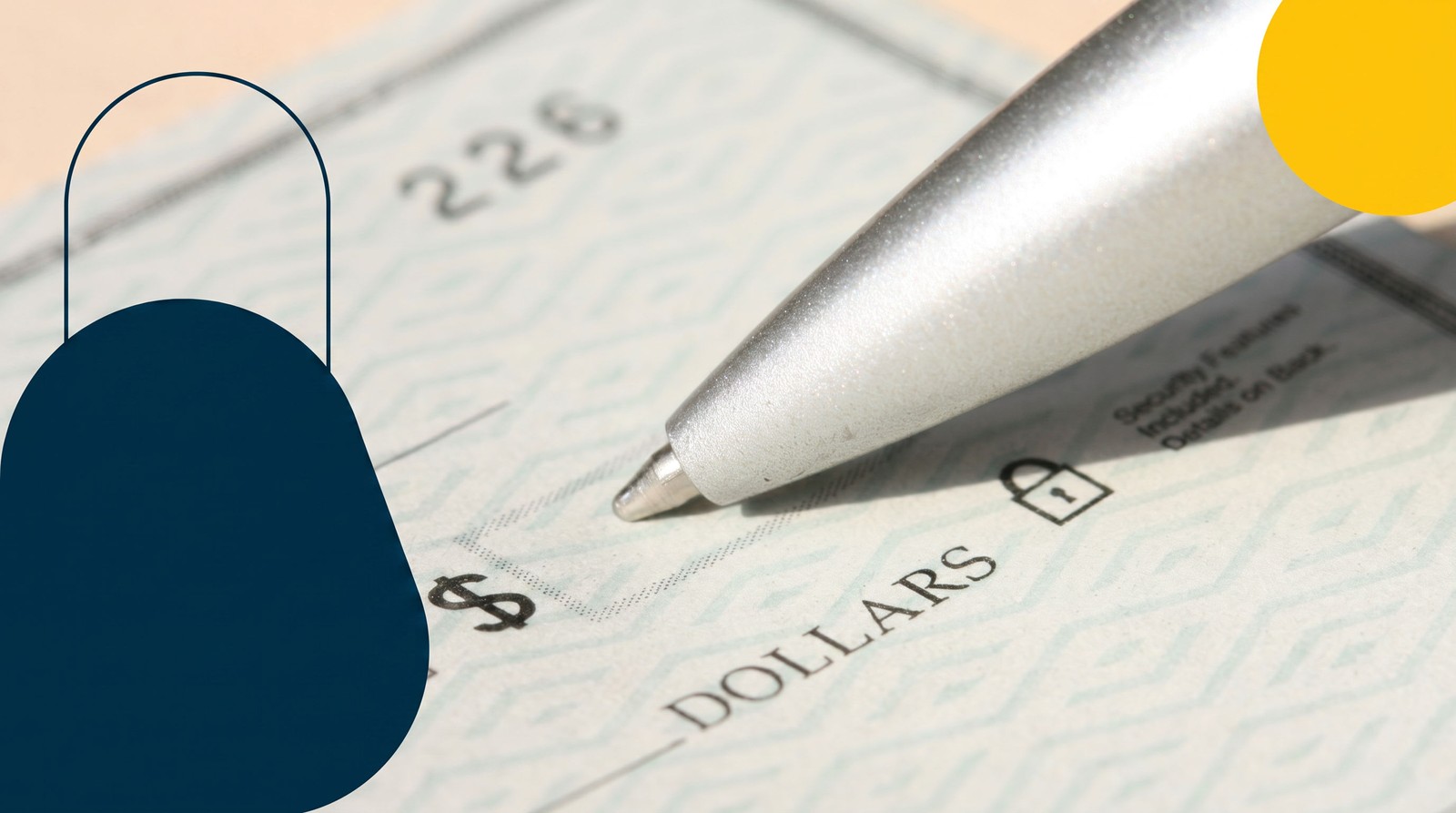 A pen writing on a bank cheque