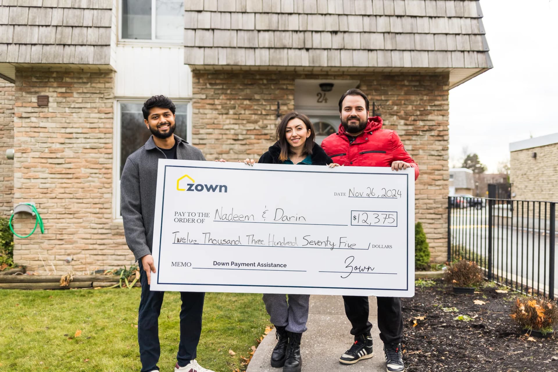 Nadeem & Darin holding their Zown boost cheque